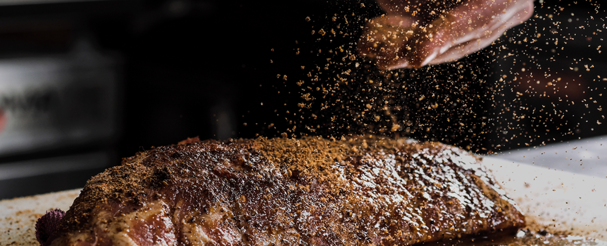 Seasoning a steak with coffee rub